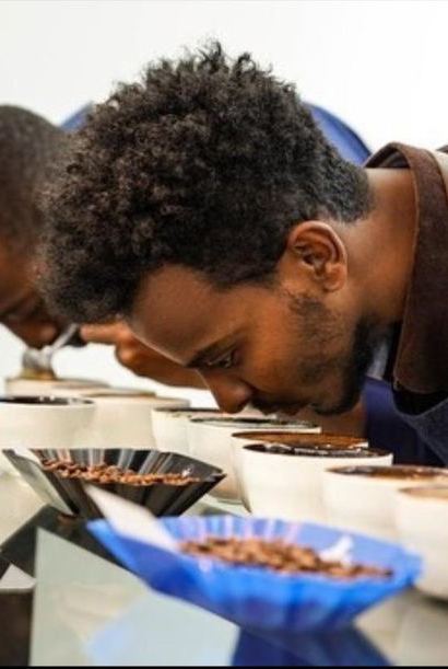 Mihret Ab cupping coffee at Daye Bensa, Ethiopia